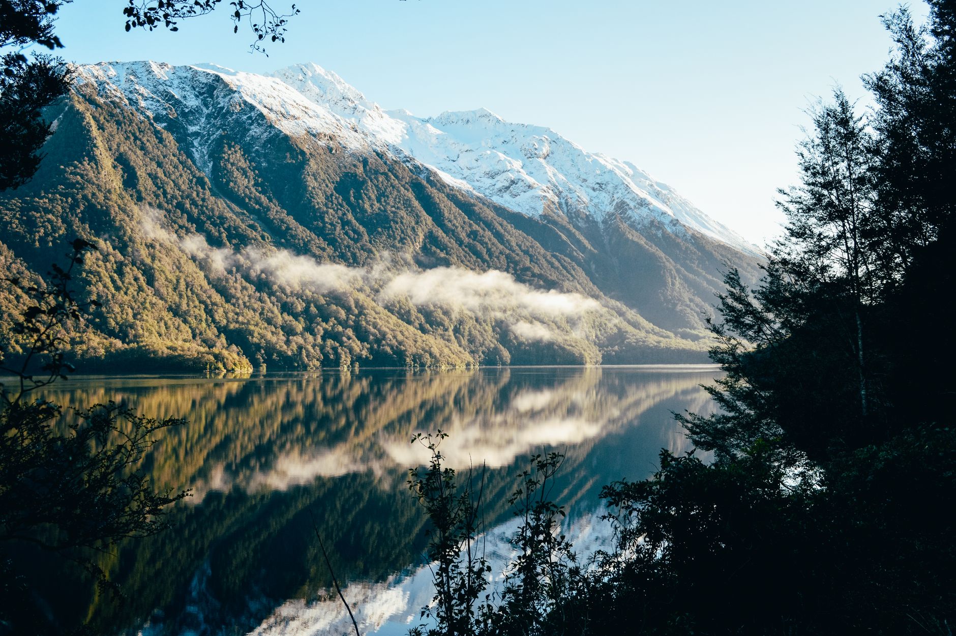 Fiordland New Zealand alpine mountains reflected in lake