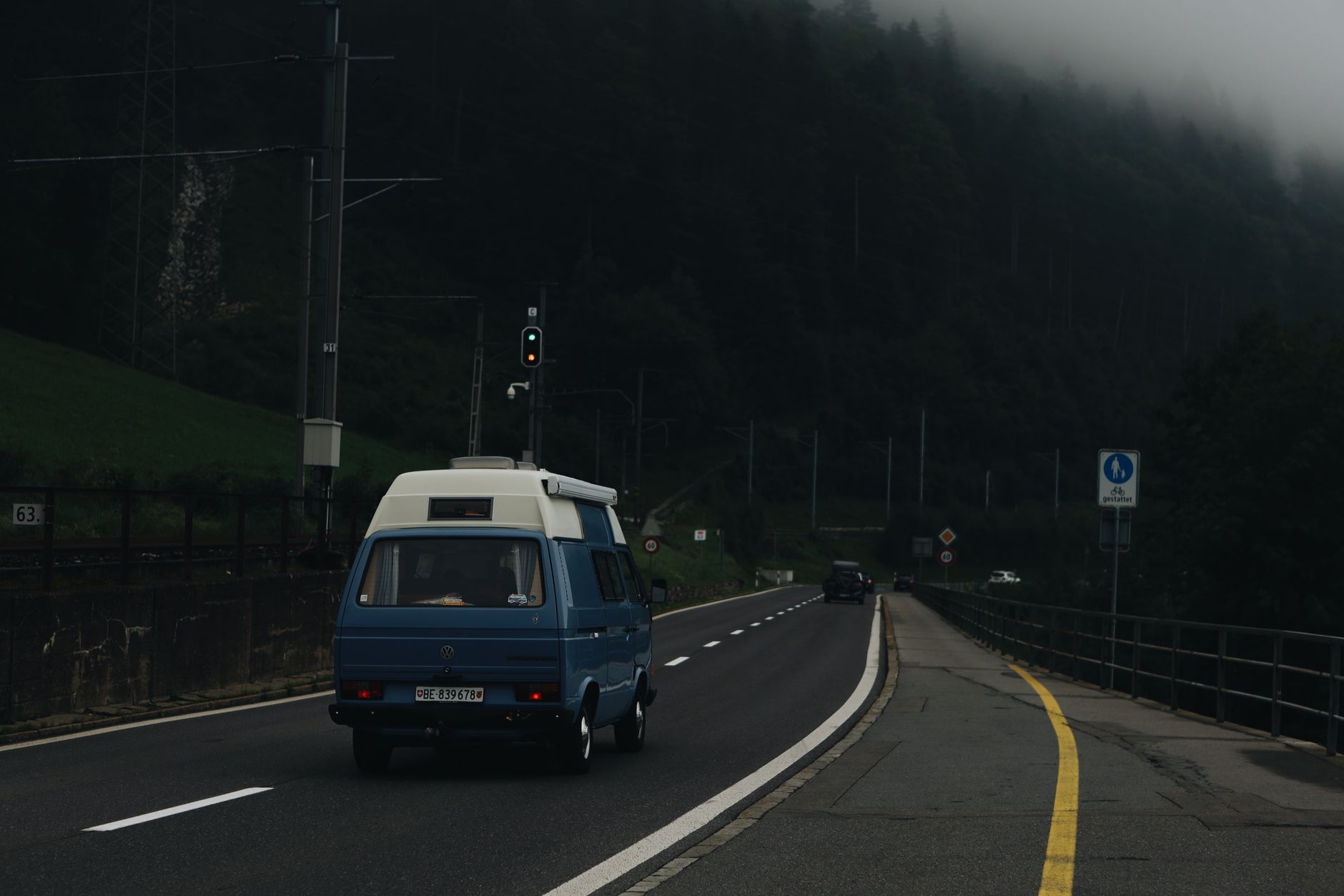 Campervan driving through scenic mountain highway